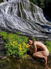 One might think a waterfall would be slippery to walk on, but her ...